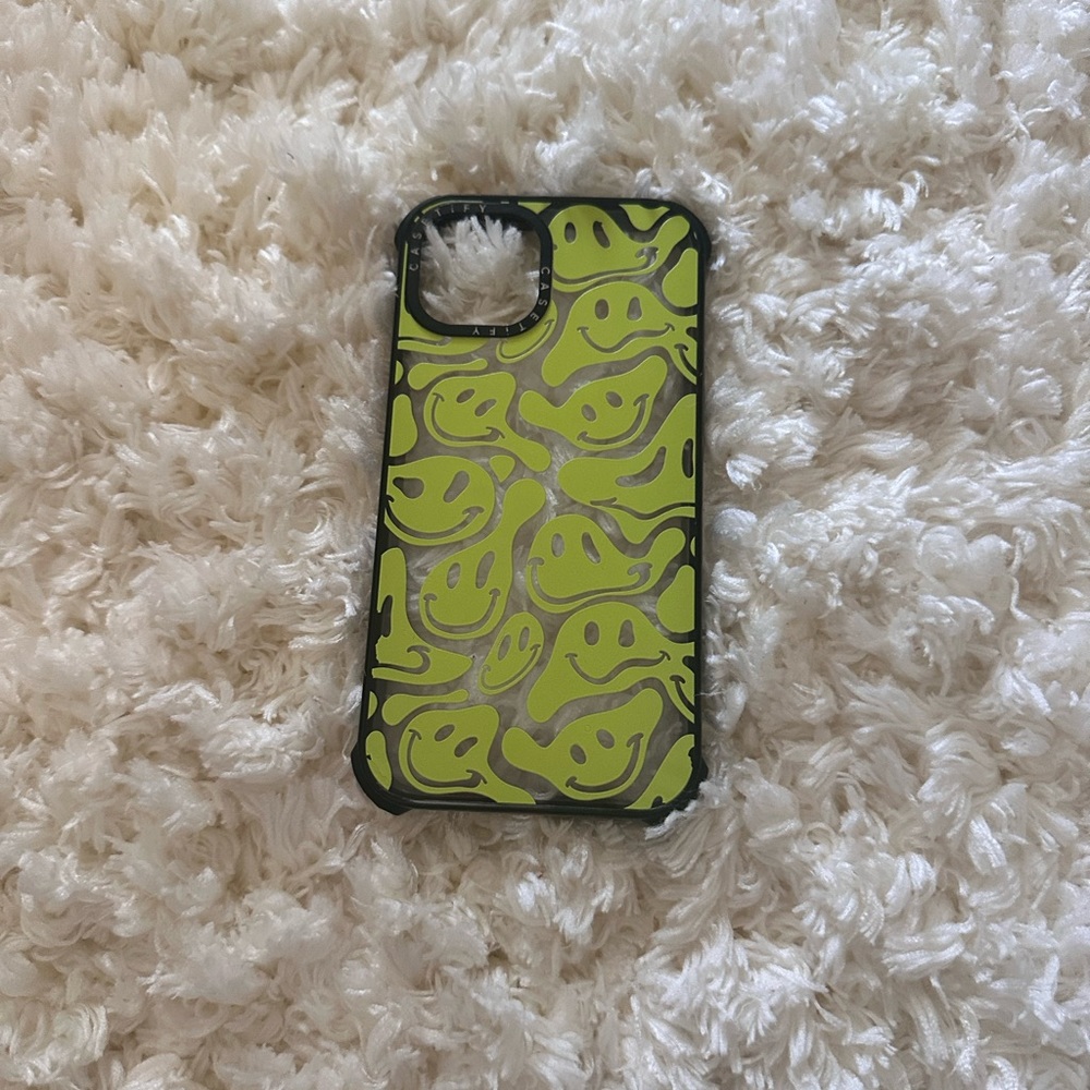 Castefiy phone case. Neon green smiley faces.